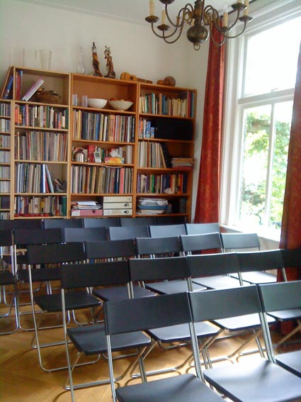 Bookcase and chairs in Monument House Utrecht, Netherlands