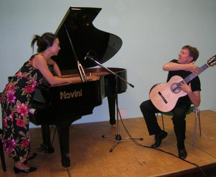 Guitar on piano